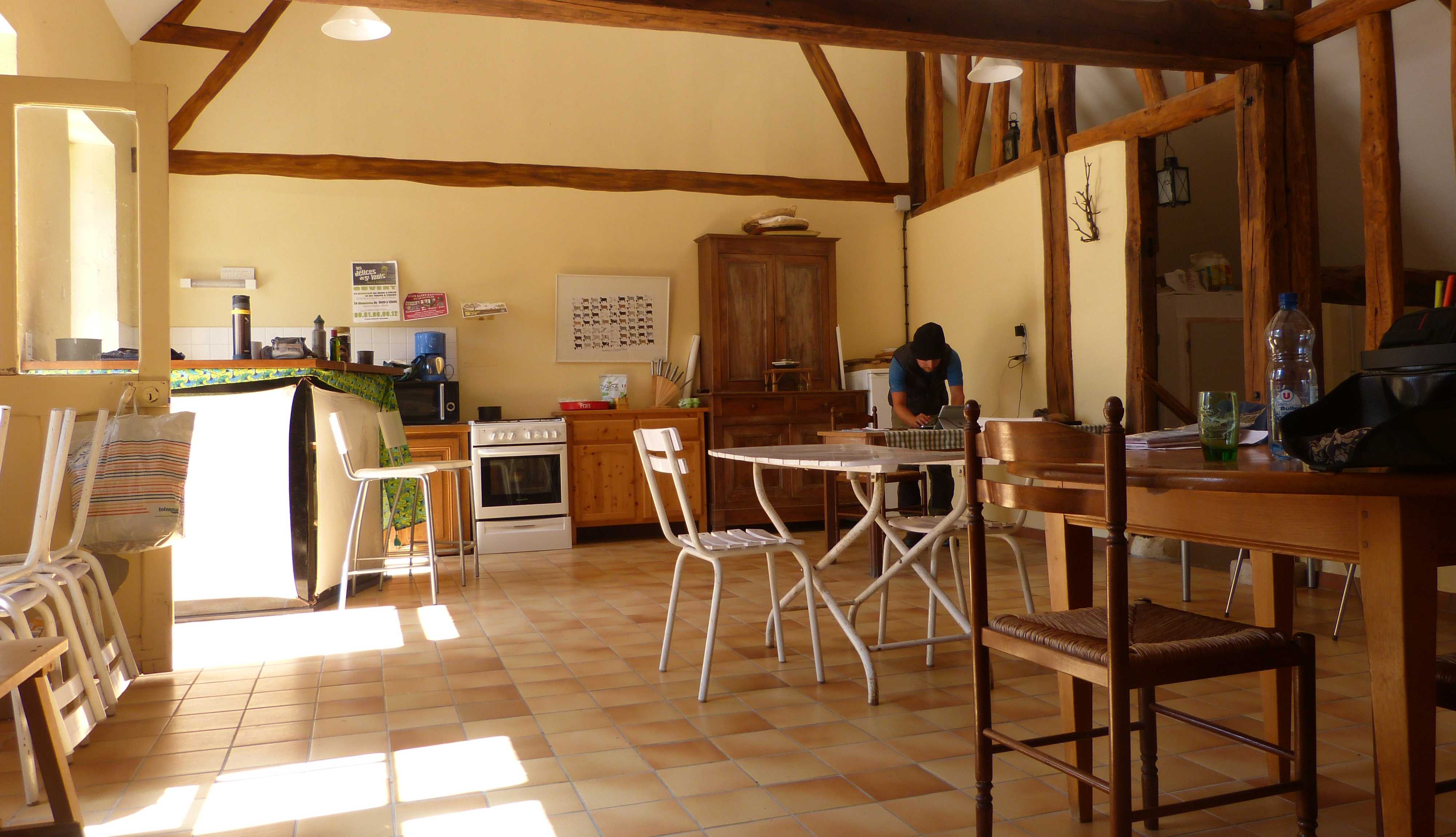 The inside of the barn, with plenty of office space and the amazing kitchen in the background