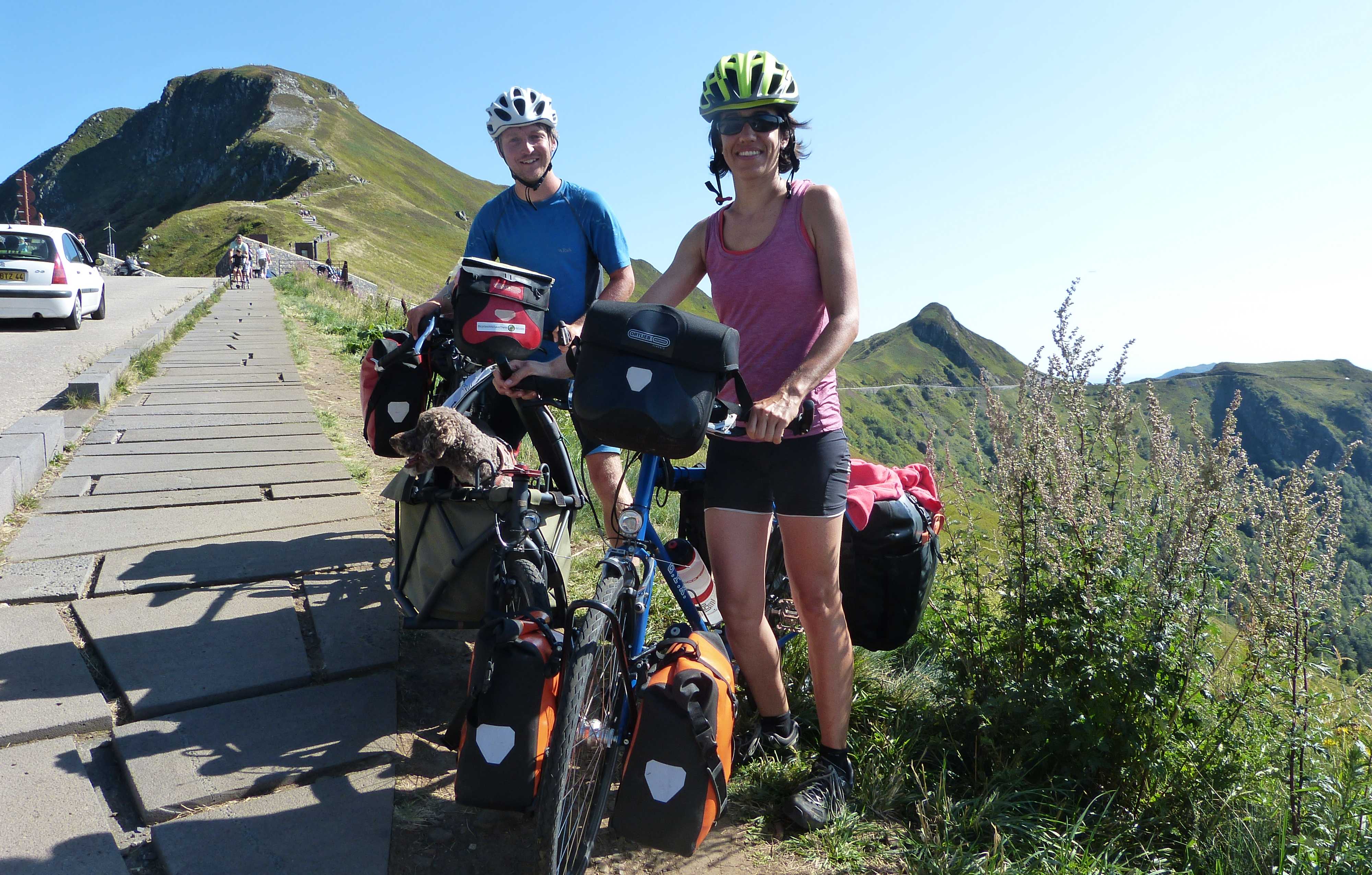 Looking very happy to have conquered the Pas de Peyrol, with the Puy Mary in the background