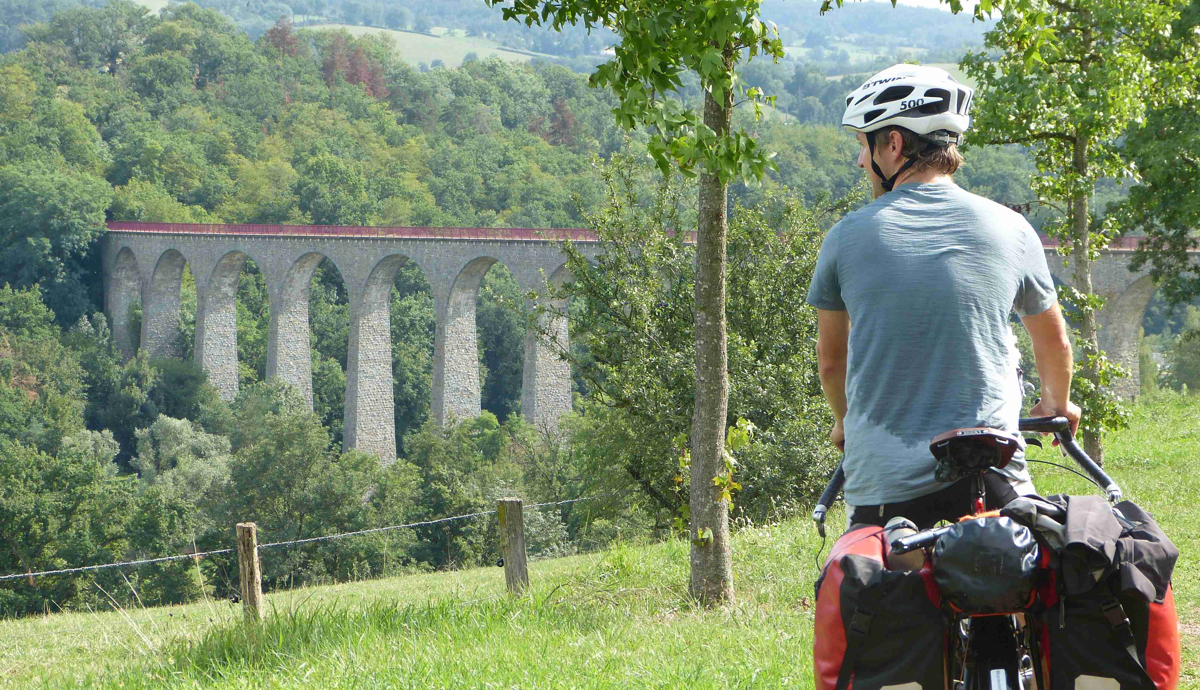 An impressive stone bridge admired by a sweaty-backed Daniel